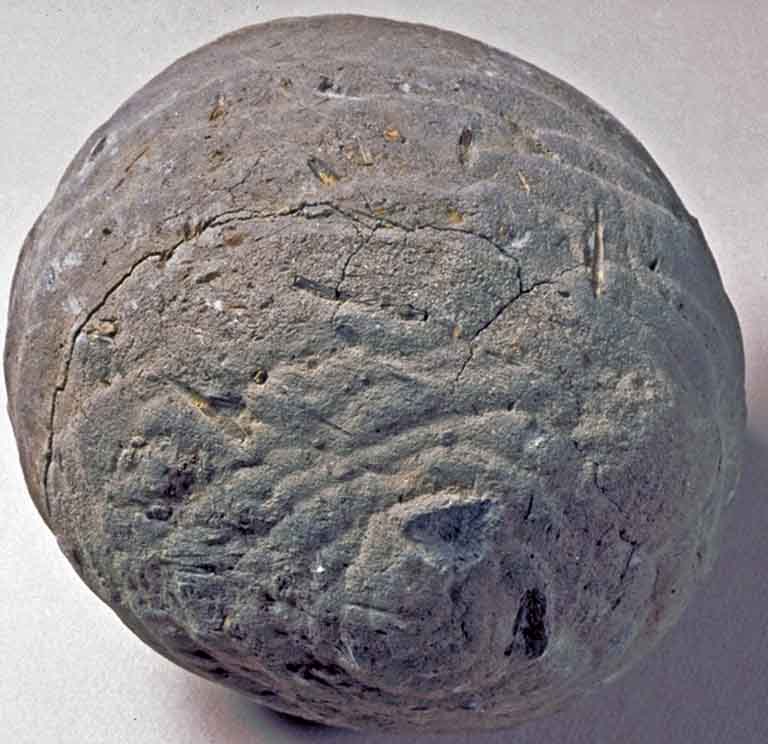 Colour photograph of gray round ball