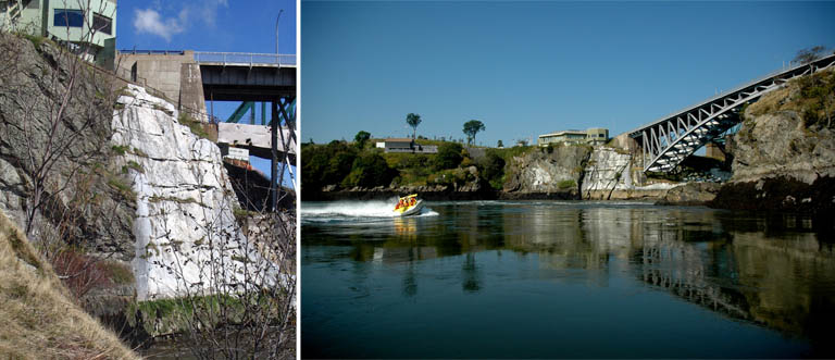 Double colour image of gray rock face and water and boat on water with buildings and bridge